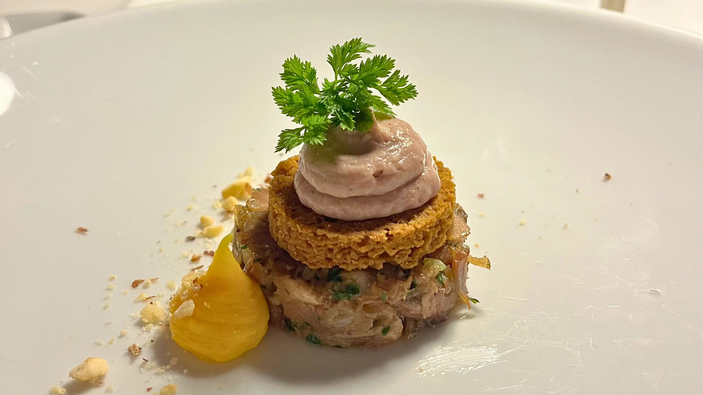 Duck with quail parfait on white plate
