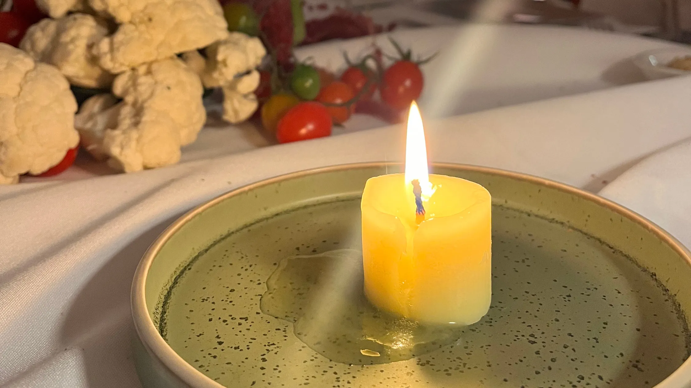 Butter candle on green plate