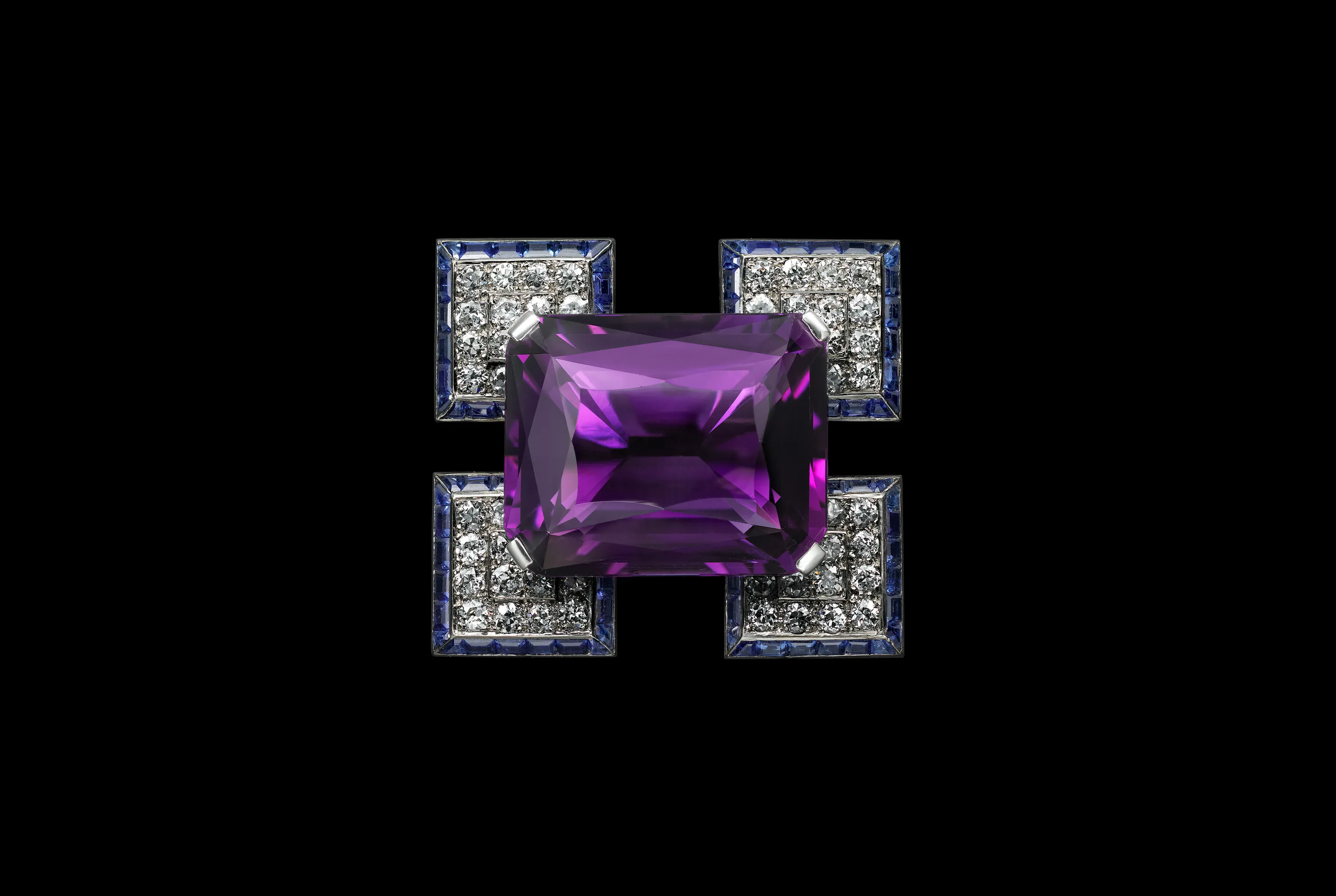 An amethyst, sapphires and diamond brooch by Cartier.