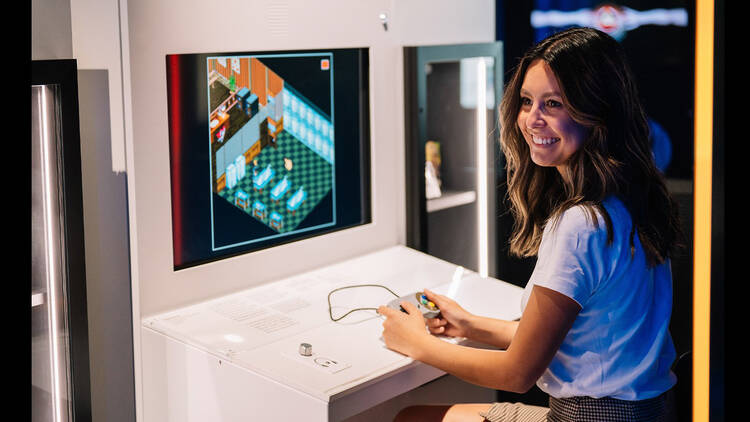 A girl playing a video game.