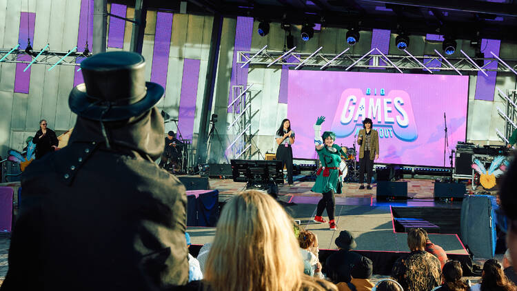 A person on stage at Melbourne International Games Week.