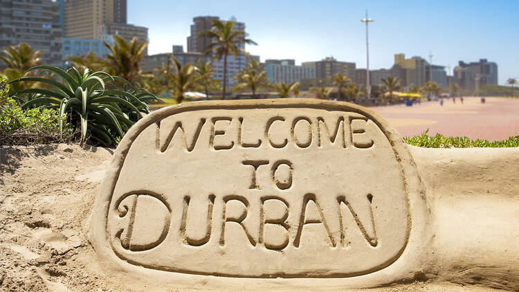 Welcome to durban sand sculpture Welcome to Durban sand sculpture with skyline of Durban waterside in the background