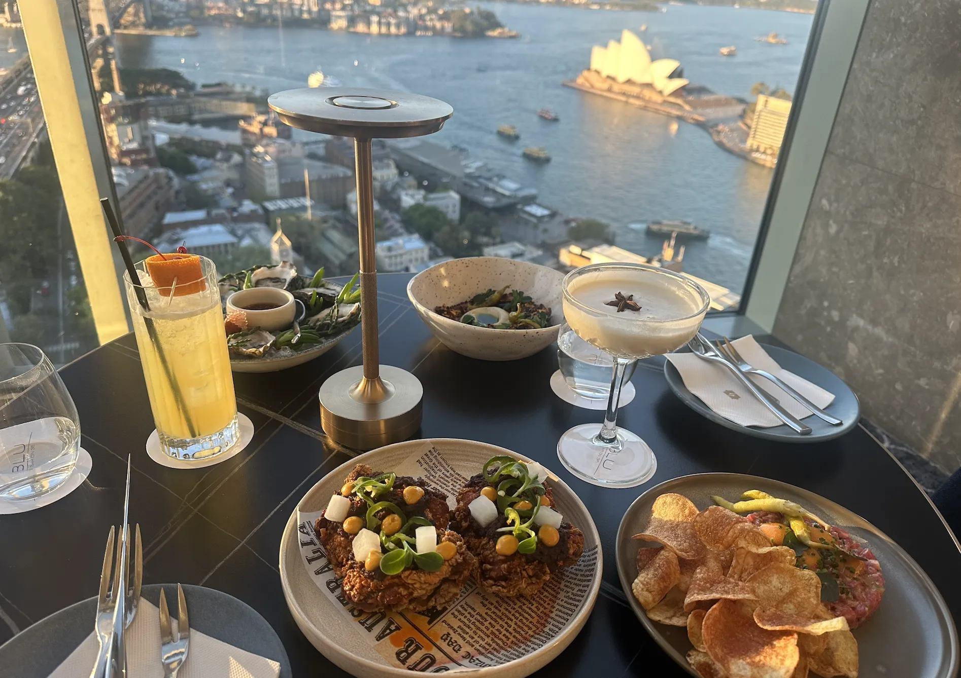 Cocktails and food at Blu Bar with views of Sydney Harbour