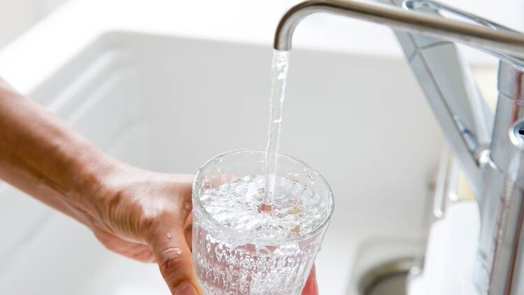 Sink, tap and glass of water