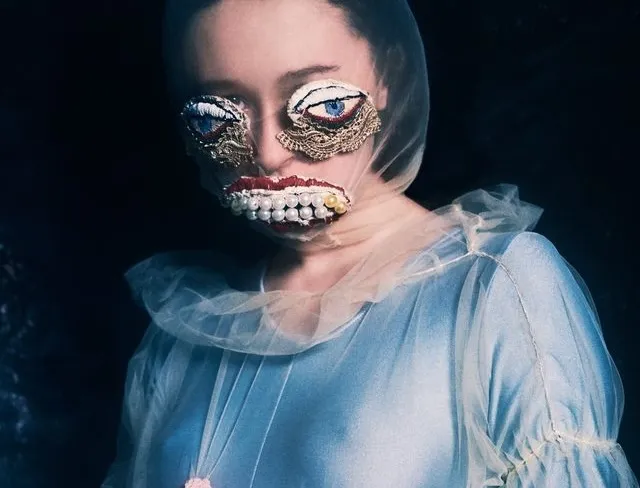 The artist Alisa Gorshenina wearing artificial eyes and a jeweled mouth