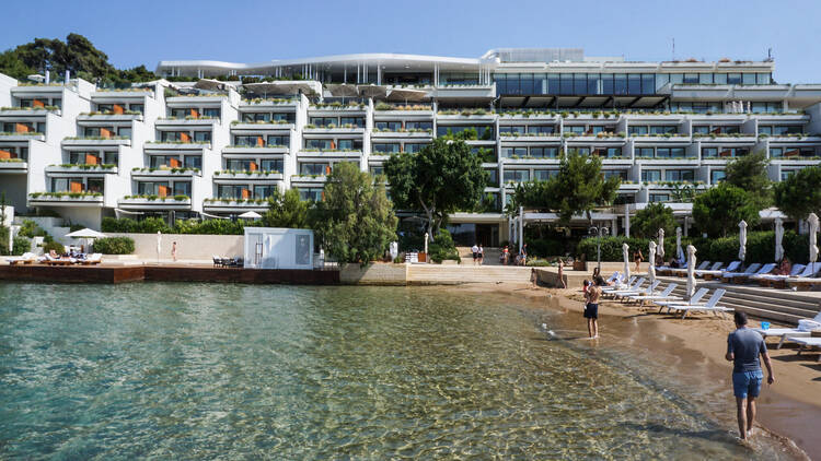The beach and exterior of the Four Seasons Resort in Athens  The beach and exterior of the Four Seasons Resort in Athens