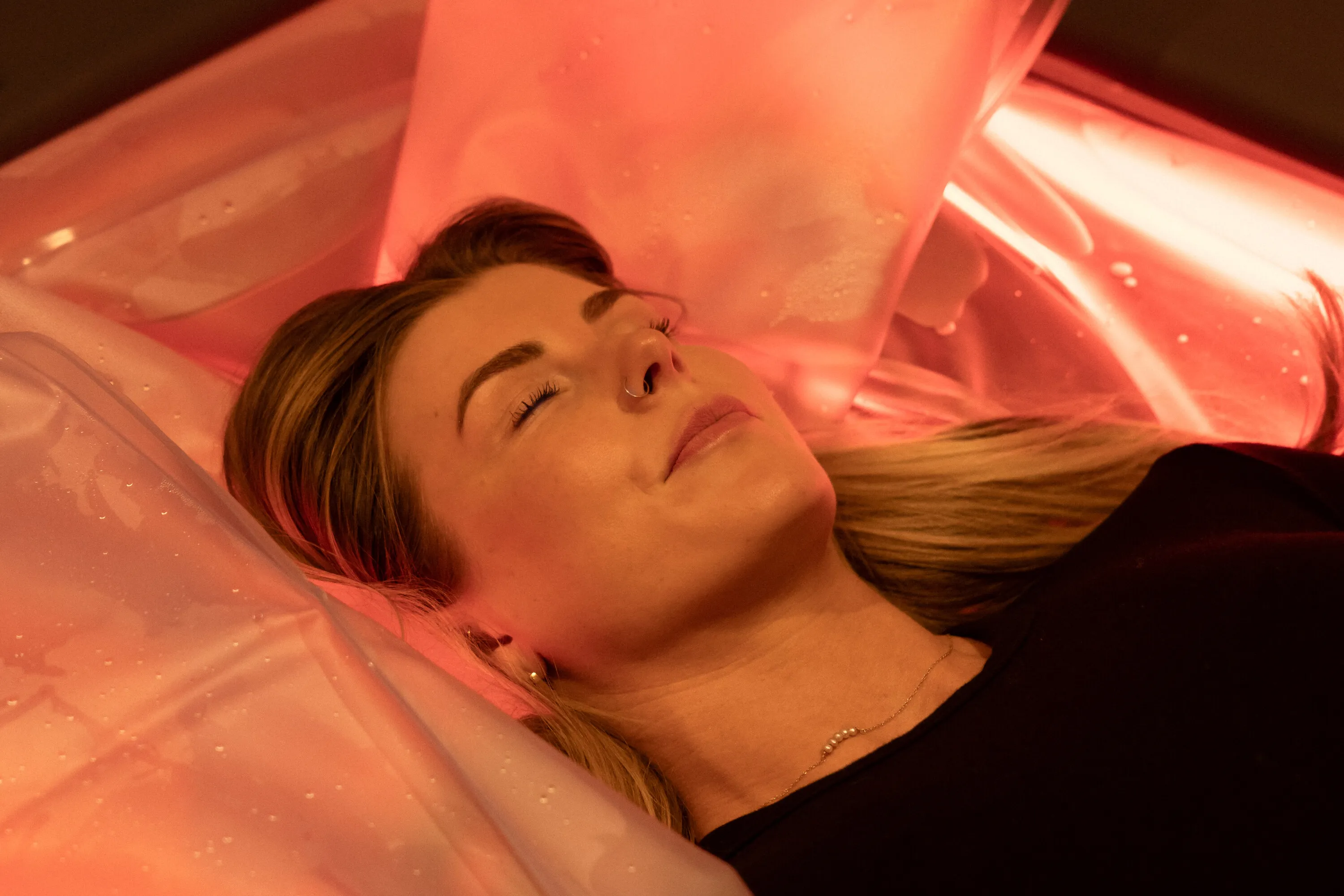 Woman lying on dry float bed