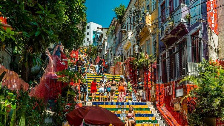 Tourists posing on the colourful Selaron steps, Rio de Janeiro, Brazil