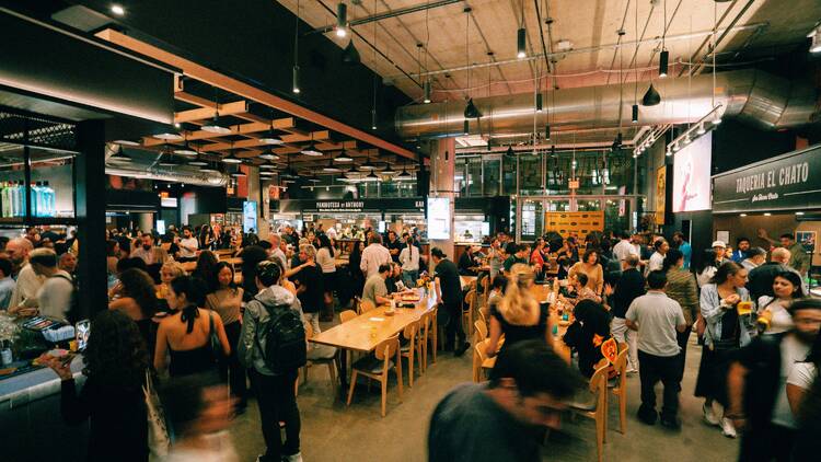 The inside of Time Out Market Union Square buzzing with people The inside of Time Out Market Union Square buzzing with people