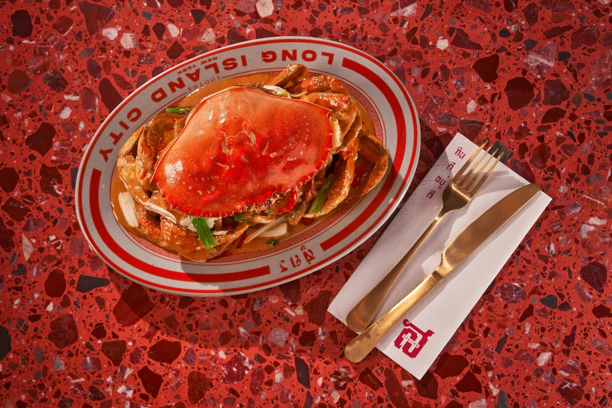 Dungness Crab on a plate on a red table