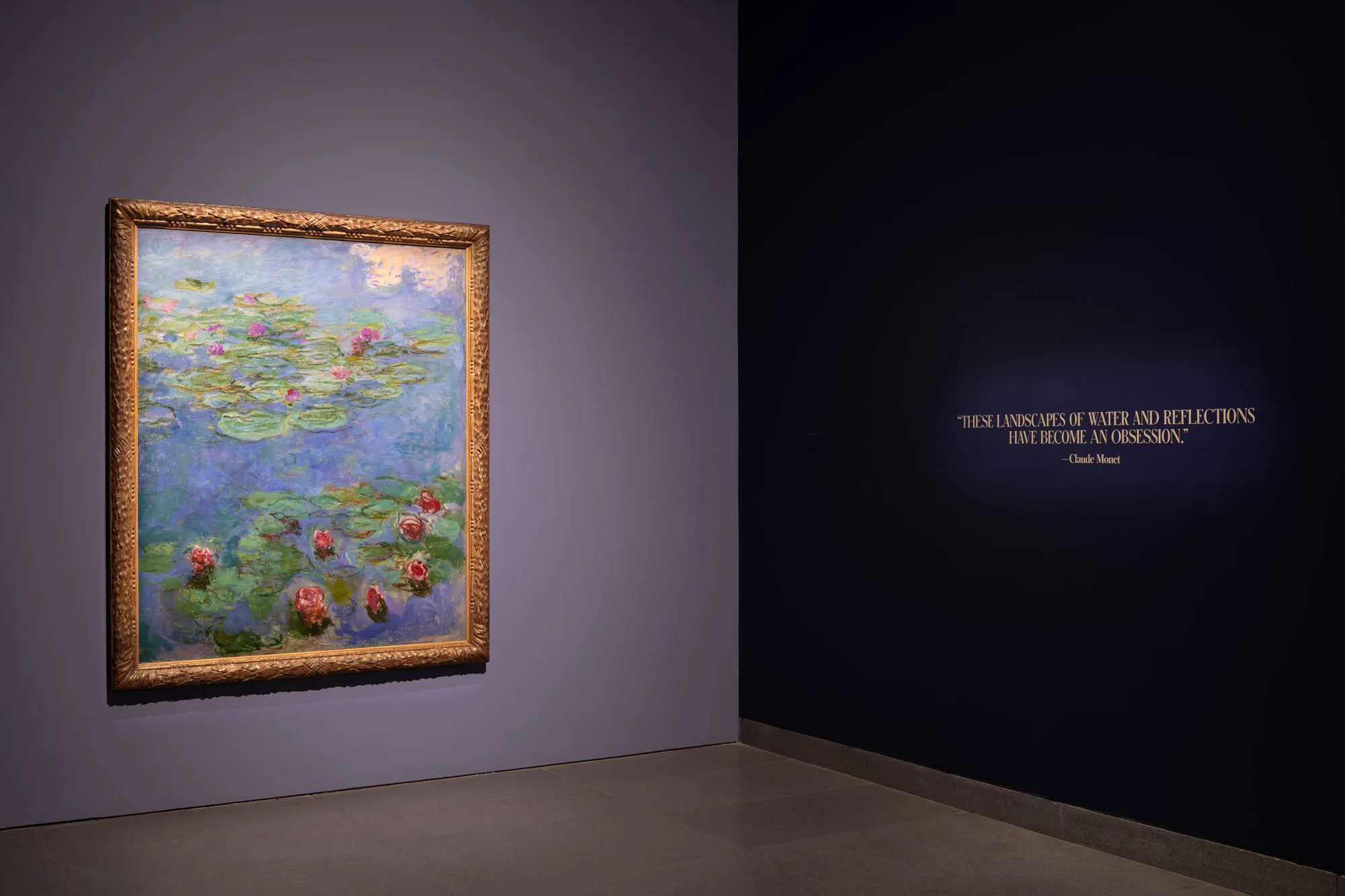 An art installation of a monet paintings of lily pads--"Water Lilies"
