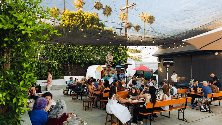 The Backyard by Kiez People drinking and dining at tables at the new Backyard by Kiez.