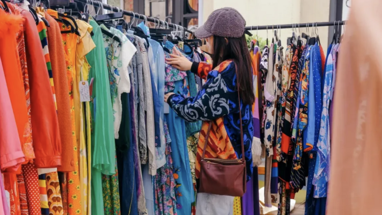 A shopper browses a clothing rack at Pickwick Vintage A shopper browses a clothing rack at Pickwick Vintage