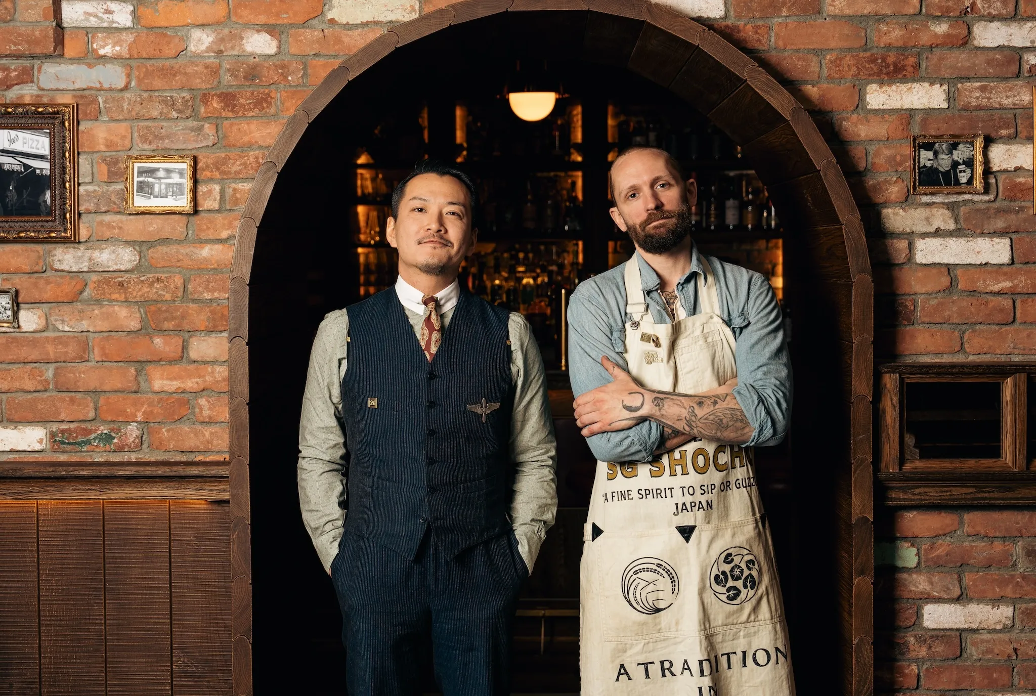 Shingo Gokan and Steve Schneider standing inside their bar Sip & Guzzle