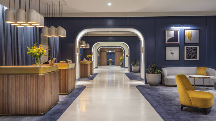 A hotel lobby in shades of blue and yellow