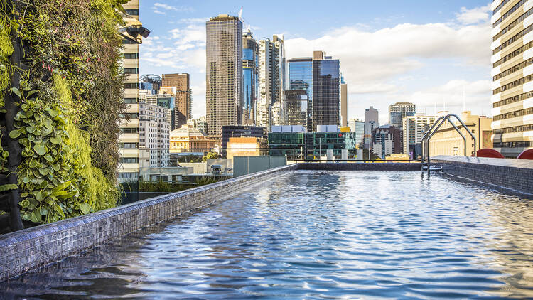 A rooftop pool looking over the city