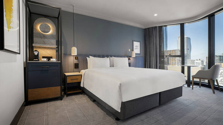 A hotel room with a city view