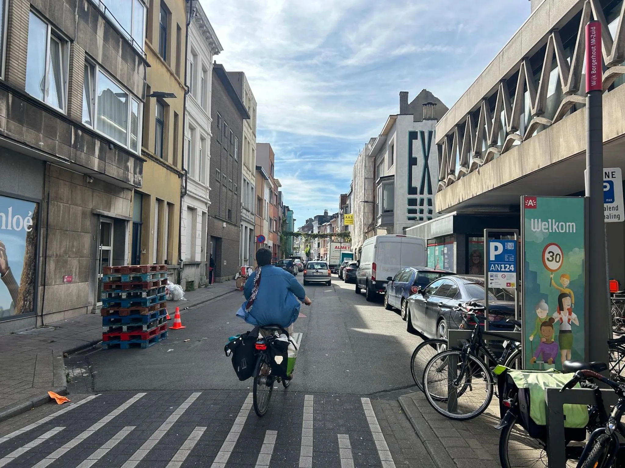 A cyclist going down a street in Borgerhout, Antwerp