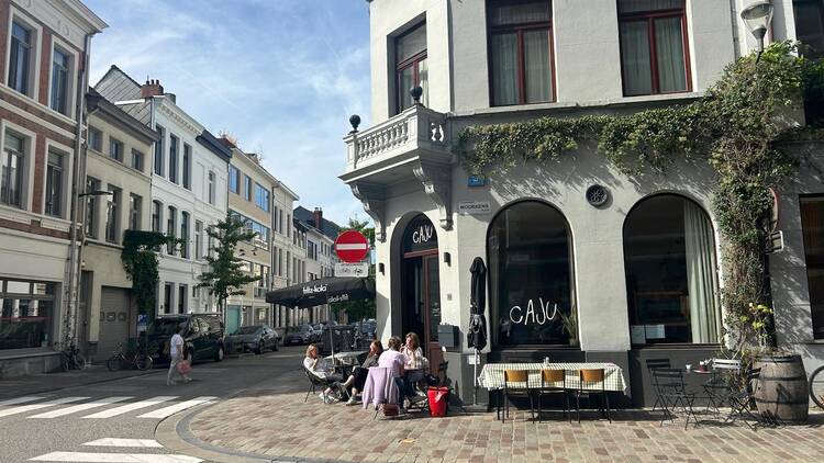 People eating al fresco outsdie a cafe in Borgerhout, Antwerp