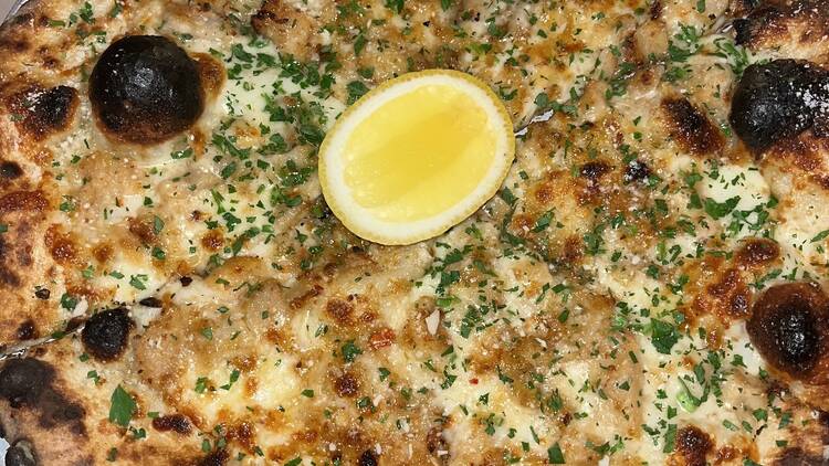 Clam Pie with a lemon wedge on top