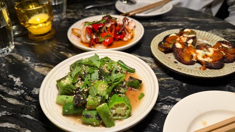 Charred okra, squid with red peppers and Japanese sweet potatoes at RVR.