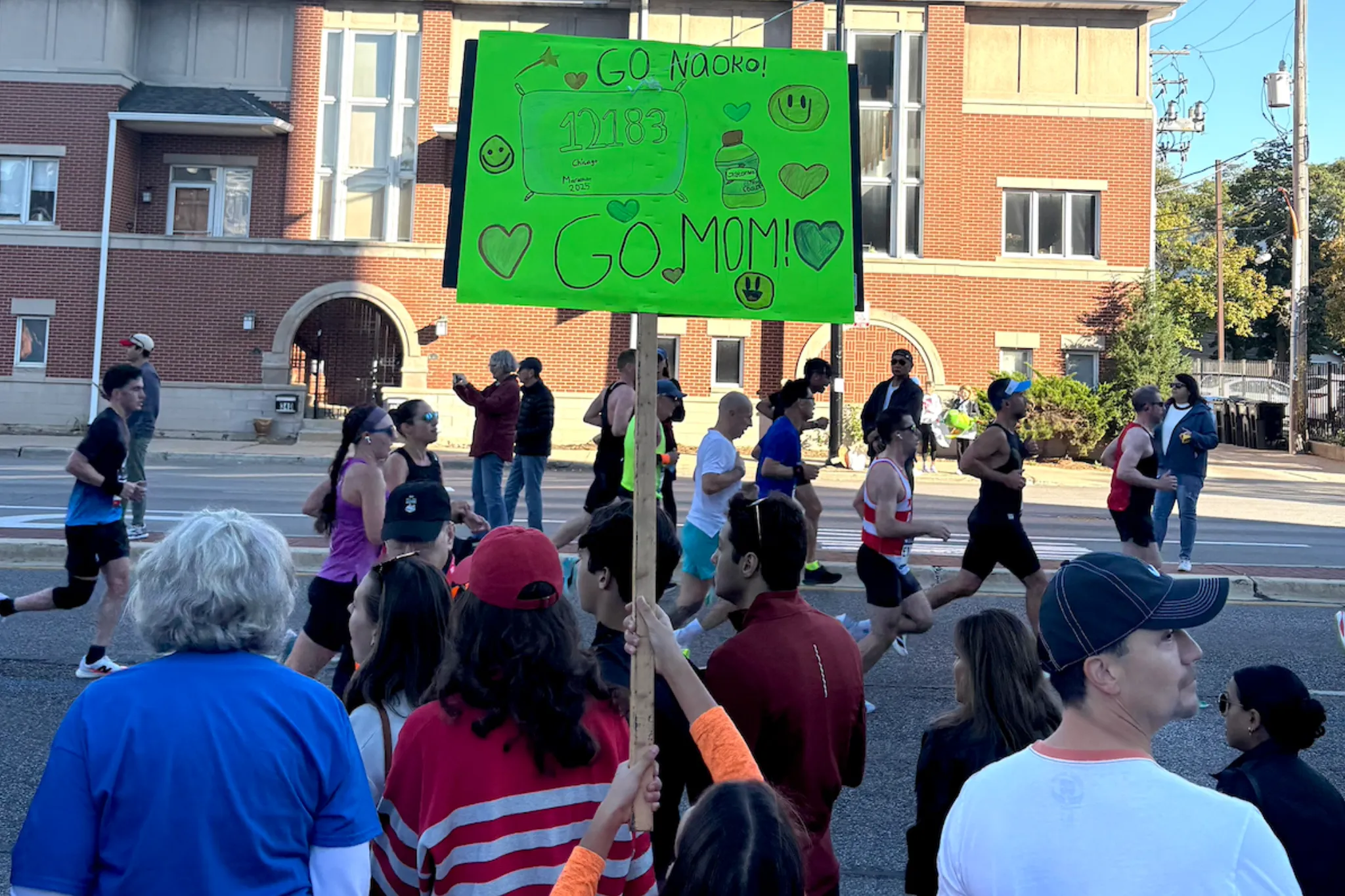 Spectators cheering on runners at the Chicago Marathon 2025.