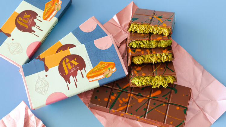 Flat lay of a Dubai chocolate bar with a green pistachio filling made by Fix Chocolatier 