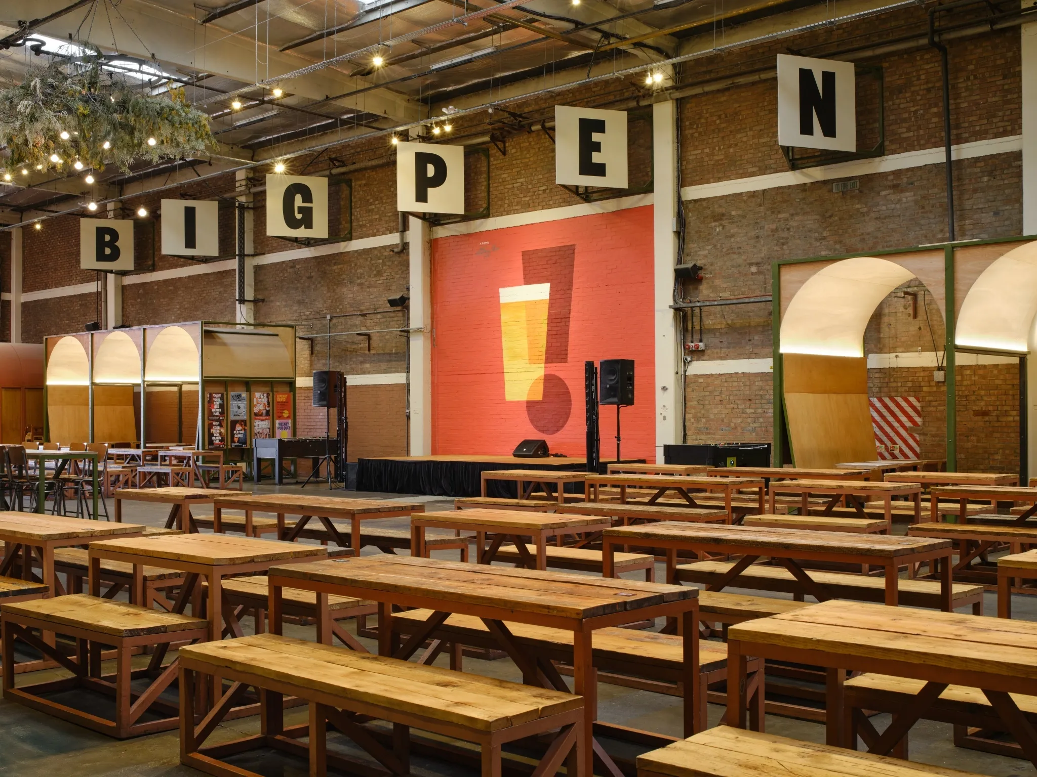 Rows of communal seating in the main hall at Big Penny Social