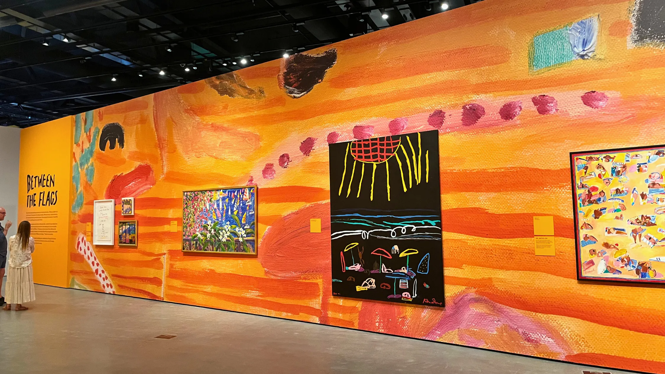 Art exhibition on orange wall