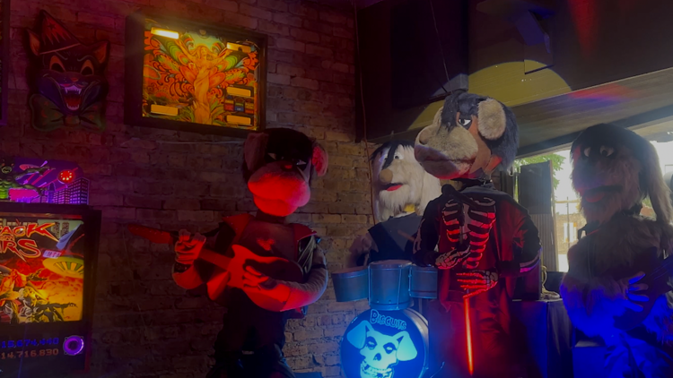 Biscuits play on the Logan Arcade stage.