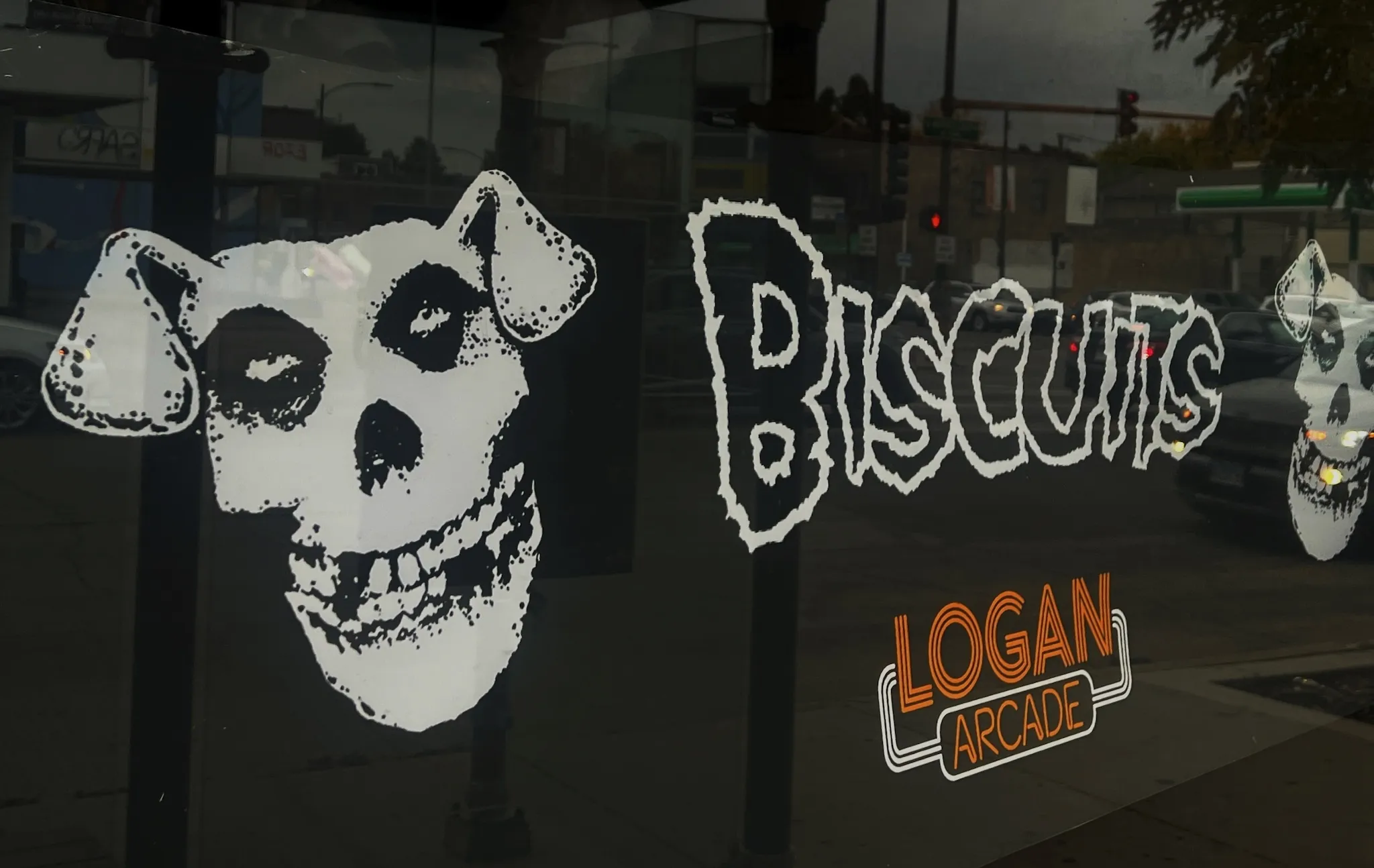 Signage advertising the Biscuits at Logan Arcade.