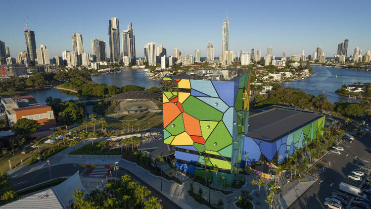 Aerial of colourful building near water