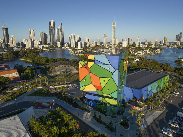 Aerial of colourful building near water