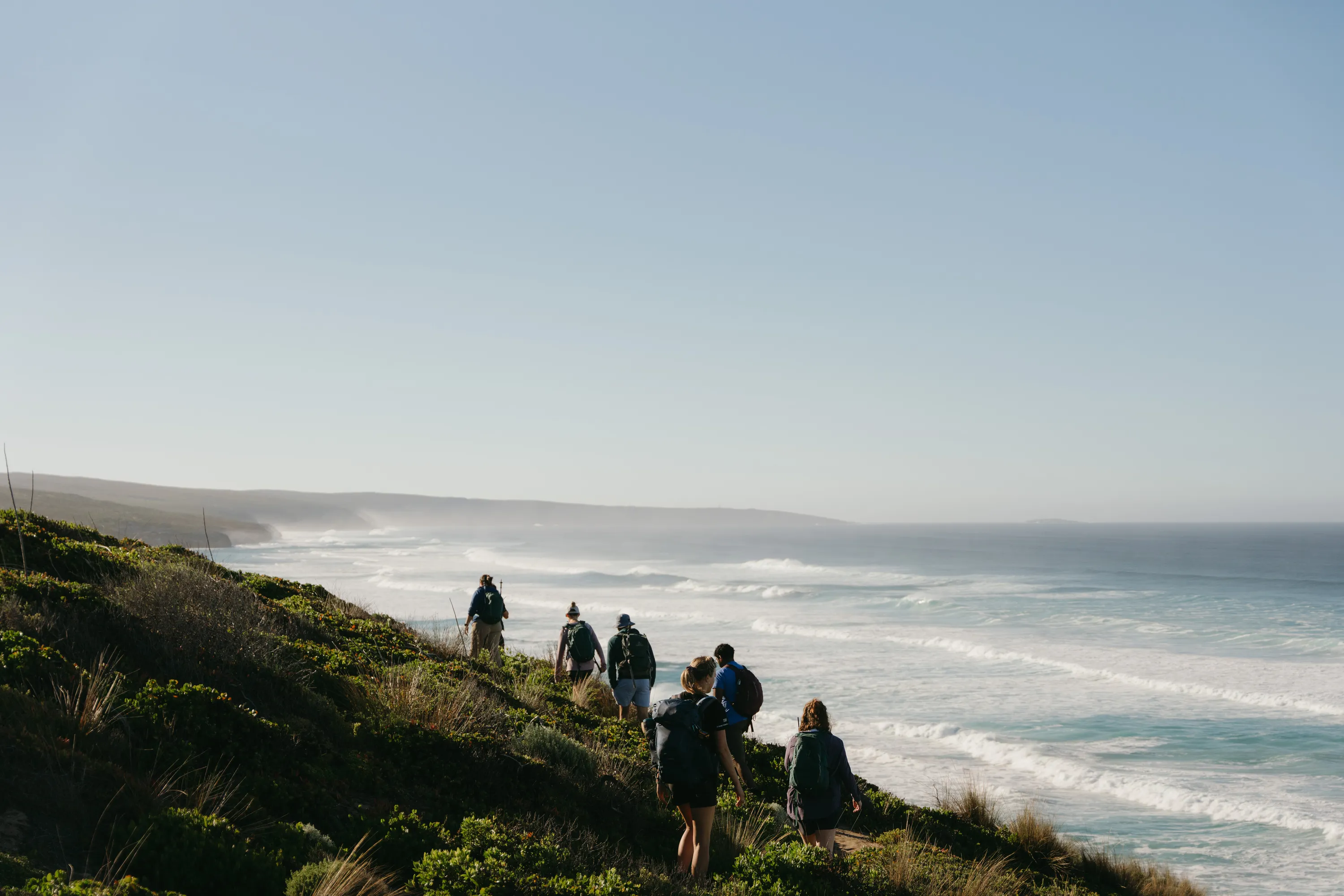 Hikers walking near coast