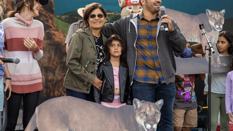P-22 Day Festival A family poses with a cardboard cutout of mountain lion P-22.