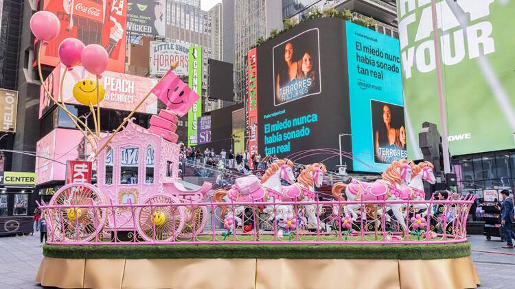 A pink carriage artwork in Times Square.