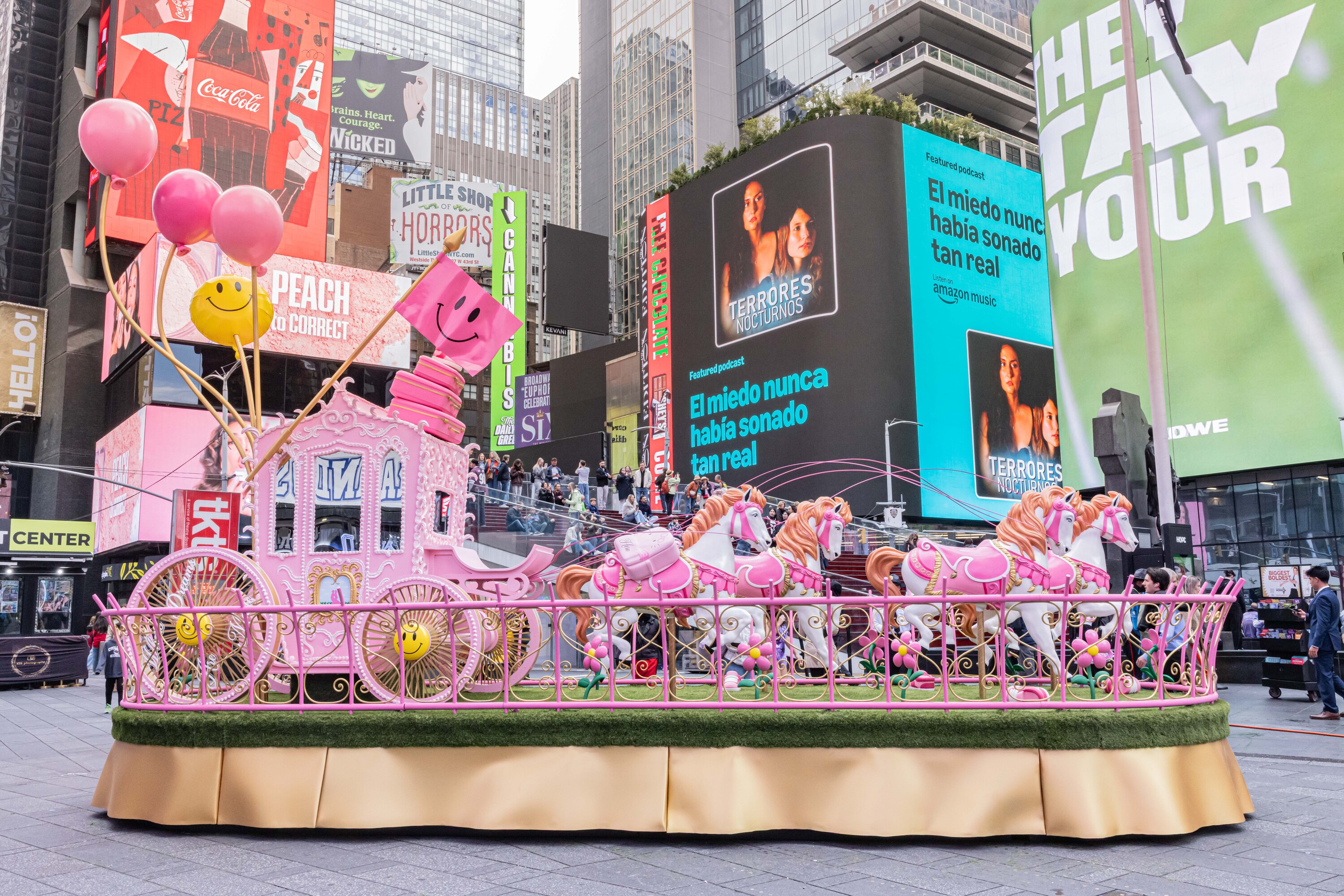 Find an enchanting 30-foot pink carriage in the middle of Times Square right now