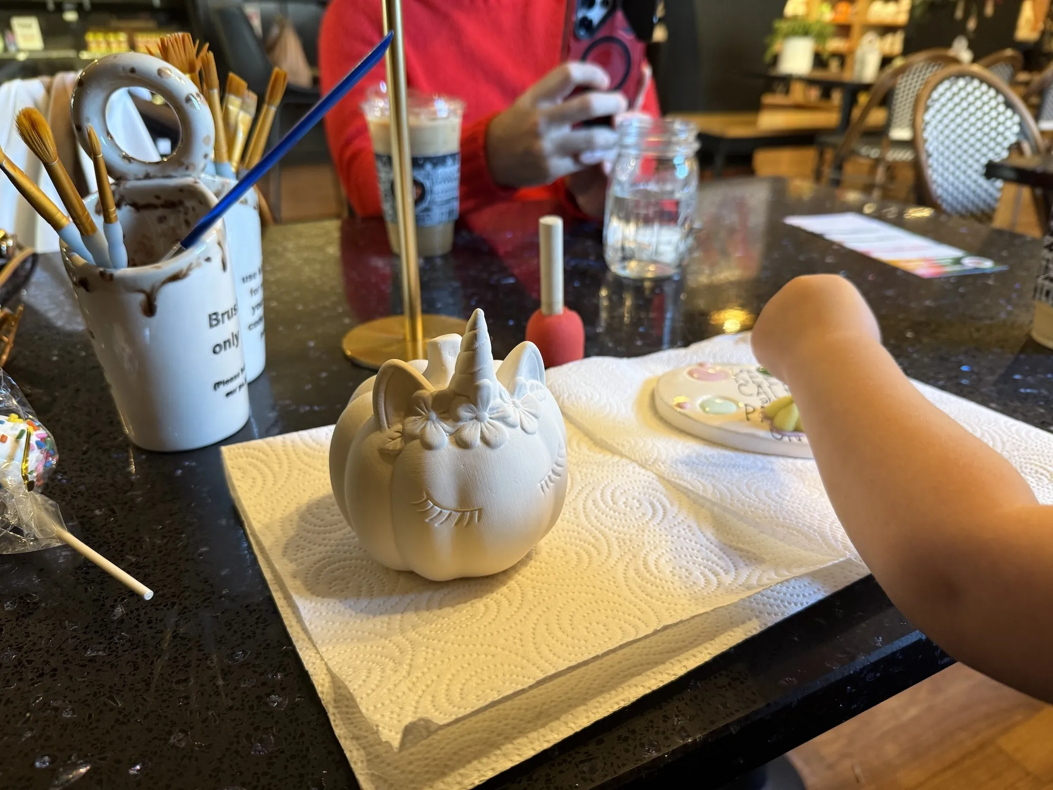 Painting ceramics at Art & Clay on Main