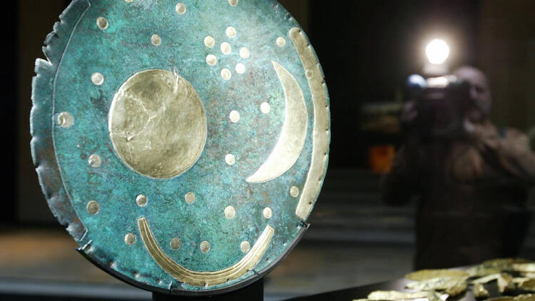A cameraman films the so-called 'Star Di A cameraman films the so-called 'Star Disc of Nebra' that is said to be humanity's oldest depiction of the skies,