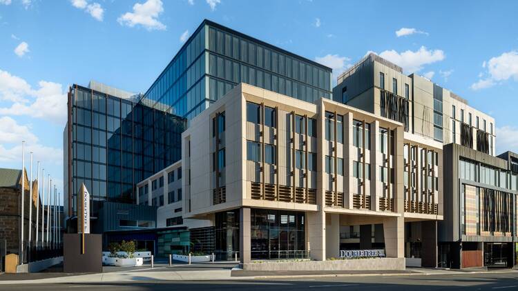 The front of a big hotel building