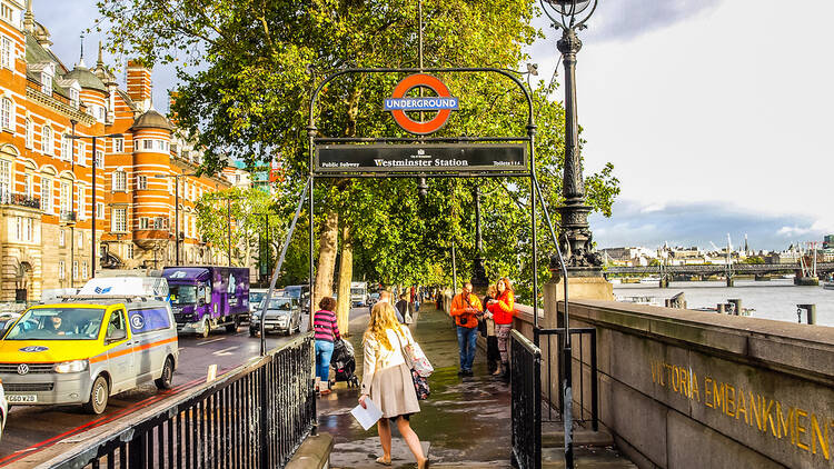 London tube station at Westminster, with river Thames London tube station at Westminster, with river Thames