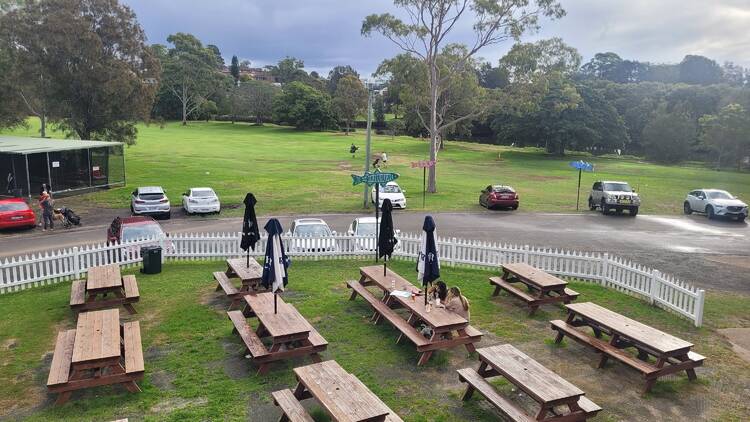 Marrickville Golf Club Tables and chairs and umbrellas at a golf course