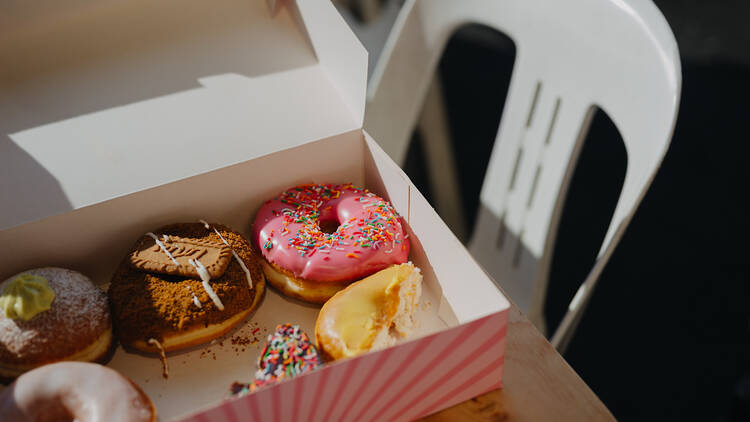 Donut Festival A box of iced doughnuts.