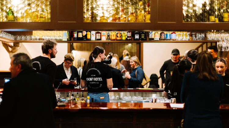 The Yack Hotel People at the bar of the Yack Hotel.