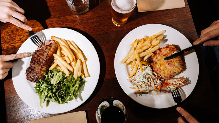 The Yack Hotel Two meals at the Yack Hotel: steak, chips and salad and a parma, chips and coleslaw.