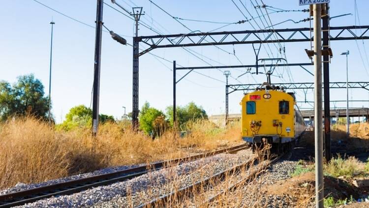 Commuter train moving through the heart of Soweto, Johannesburg  Commuter Train moving through the heart of Soweto, Johannesburg