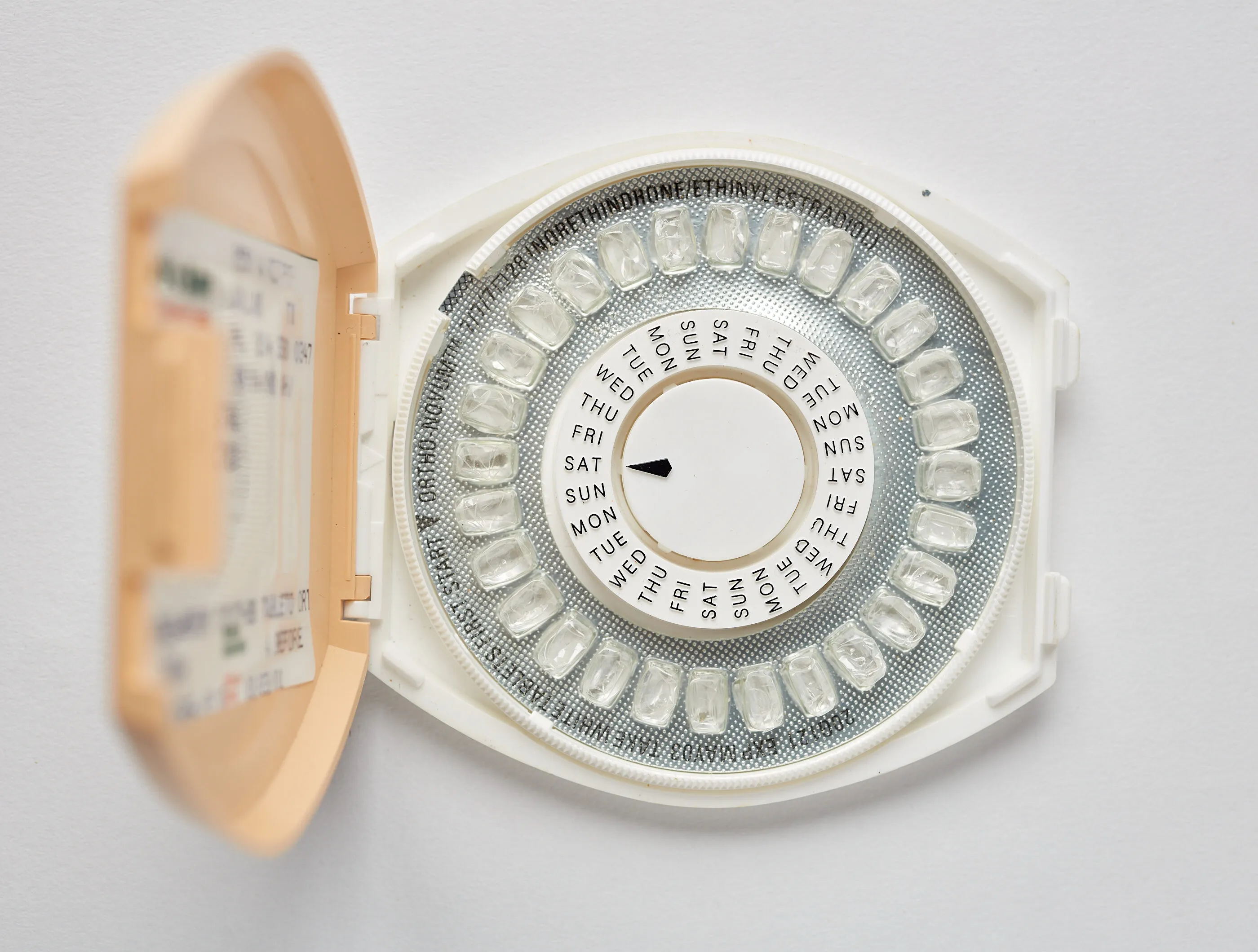 A round package of birth control.