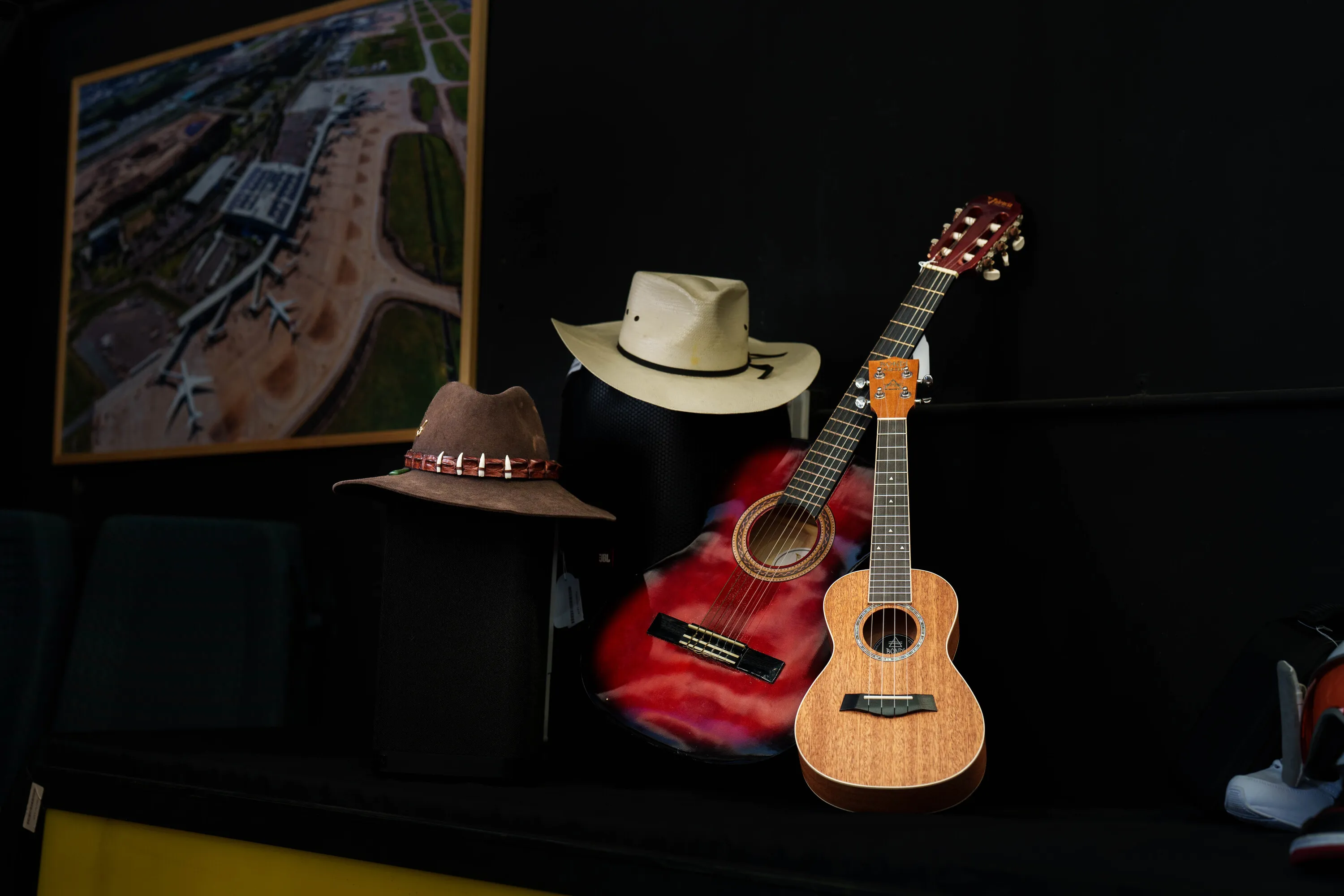 Two guitars with cowboy hats