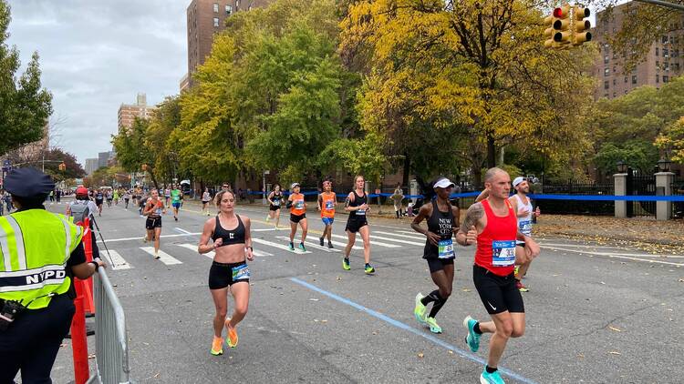 Runners taking part in the New York City Marathon on a fall day.