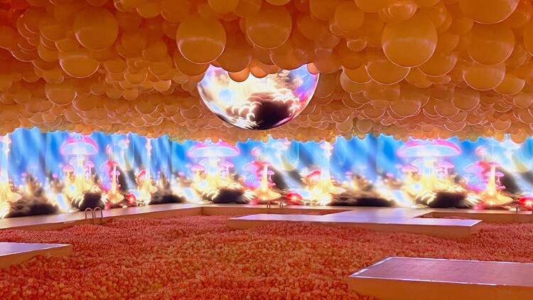 A ball pit crowned by balloons at the Balloon Museum's "EmotionAir" exhibition.